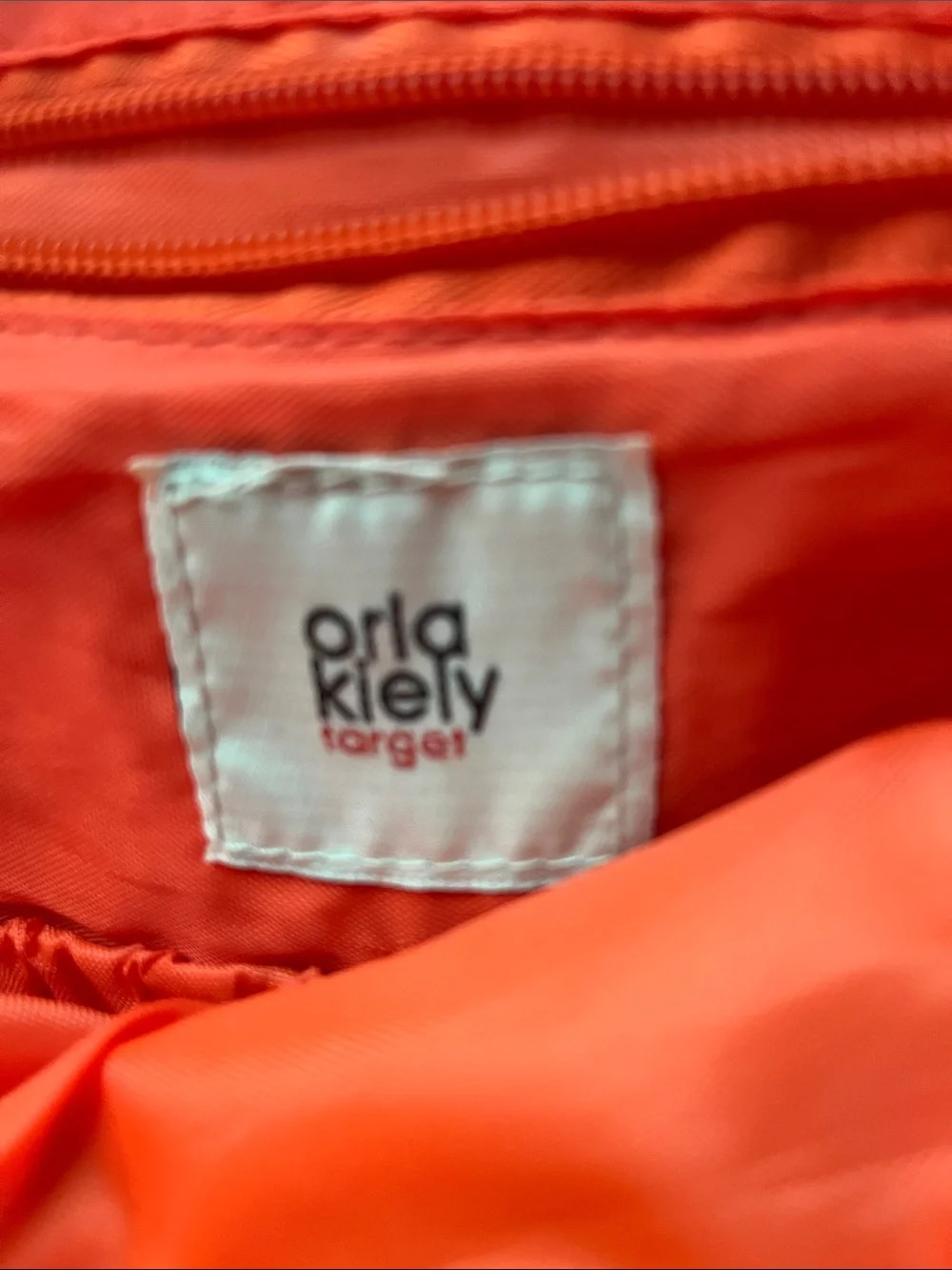 Brown, beige and orange diaper bag. Orla Kiely (Target).